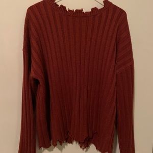 Over sized sweater with the “torn” look